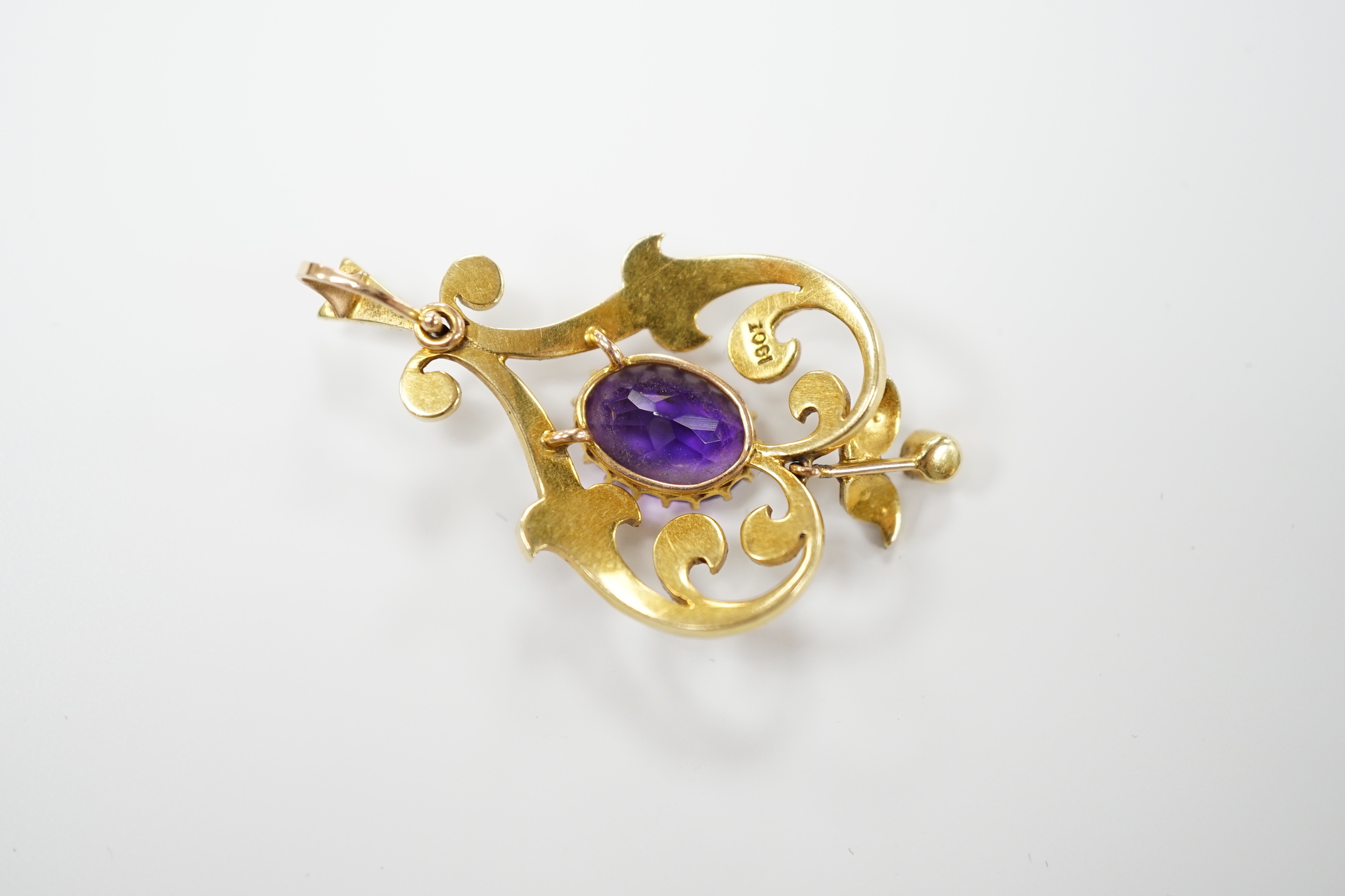 An Edwardian 15ct, amethyst and split pearl cluster set pendant, 40mm, gross weight 4.6 grams.